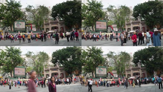 4k时间流逝: 在香港王大仙寺入口处散步的人群和旅行者