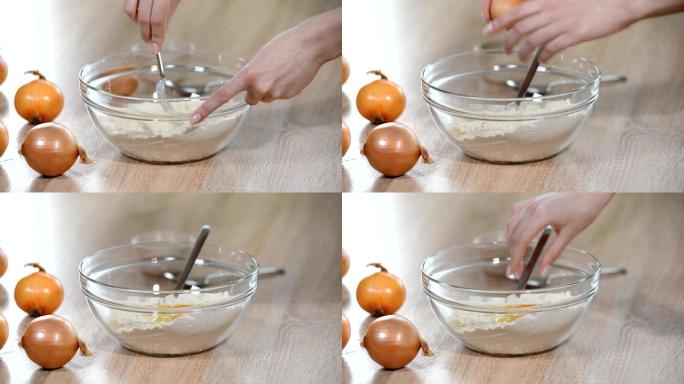 在装有面粉的碗中加入一个鸡蛋。