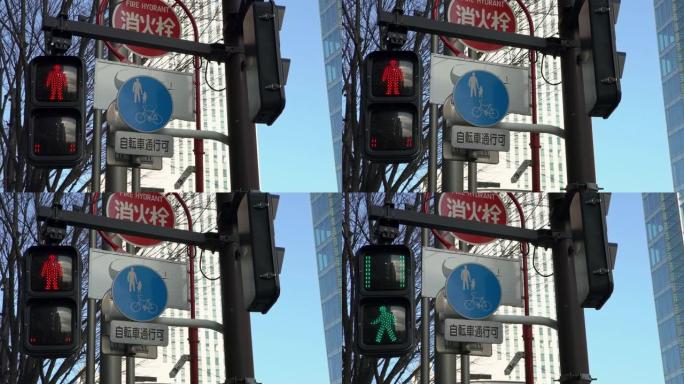 4K，亚洲行人横道标志东京市。交通灯改变颜色。