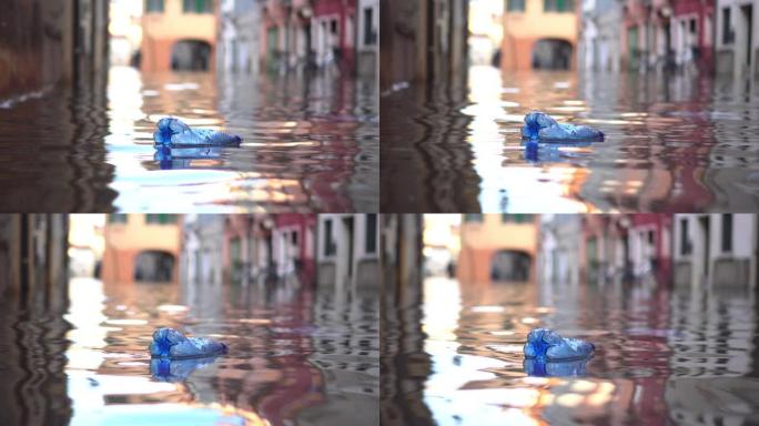 瓶子漂浮在被洪水淹没的城市的水面上