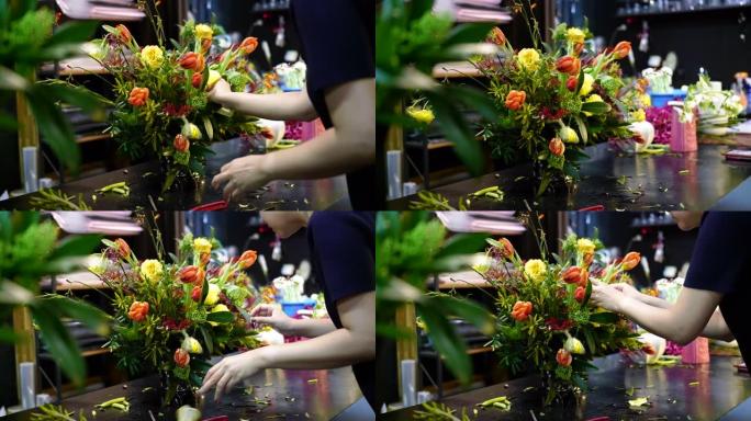 一个花店正在安排花束，手工拍摄