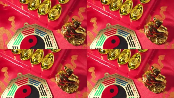 带有中文的金元宝上写着“好运”。黄金鼠。有阴阳标志的金盘。慢慢的锅。中国新年。农历新年。