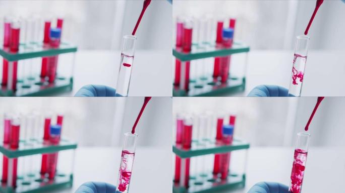 用移液器分析红色液体以提取DNA的科学家