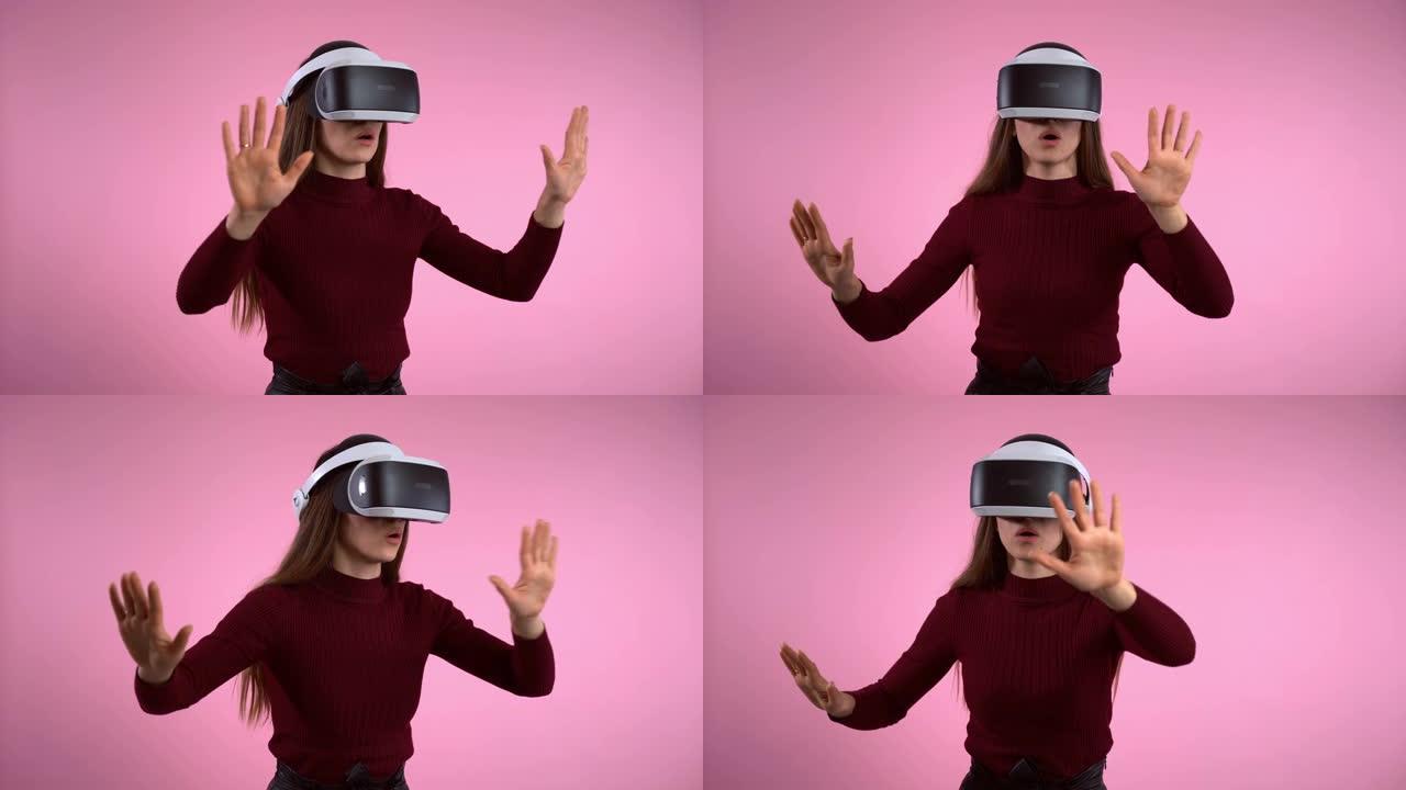 虚拟现实眼镜耳机，女人在增强现实中打手势。带有虚拟现实耳机，抽象动作和手势的交互式视频游戏。未来工程