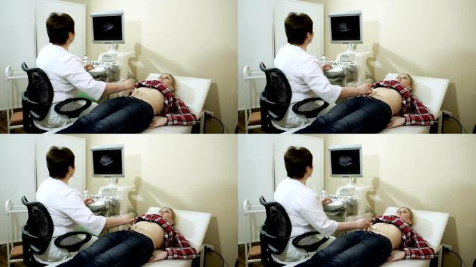 医生用超声波扫描仪检查女性腹部器官。高清