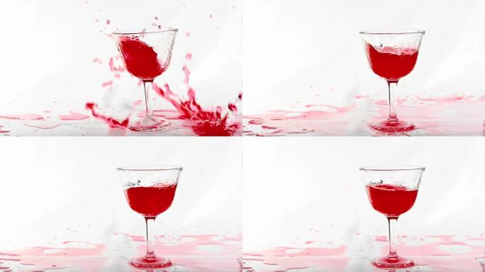冰块掉落，飞溅成白色背景上的红色新鲜酒精鸡尾酒饮料，拍摄慢动作。