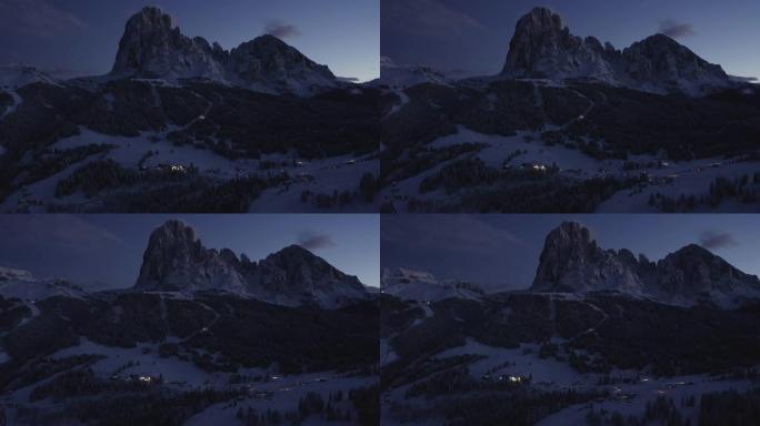 多洛米蒂瓦尔加迪纳滑雪胜地山村的空中夜景。