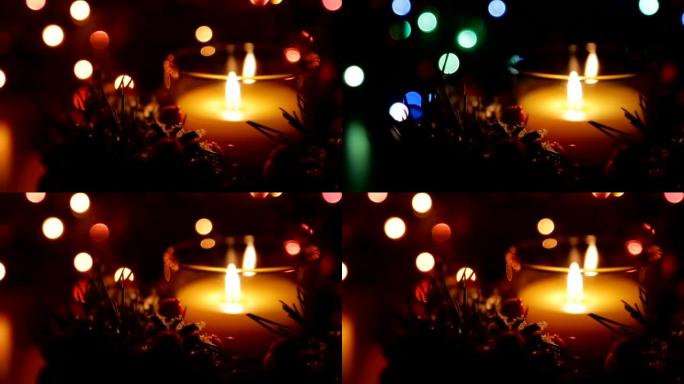 圣诞之夜，在bokeh的背景下点燃的蜡烛