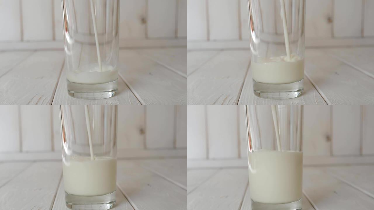 将牛奶倒入浅色木制背景上的玻璃杯中的特写镜头。