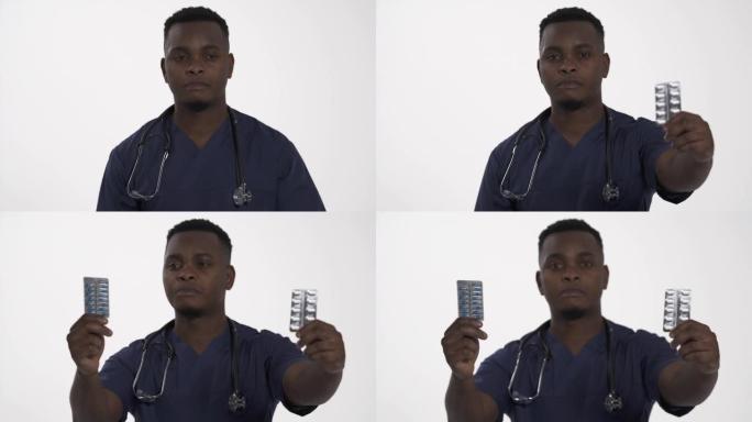年轻的非洲医生的肖像照片展示了带有不同类型药丸的泡罩包装。医疗保健和药房。选择概念