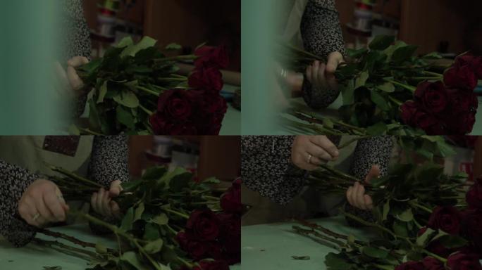 花店加工并制作了一束猩红色的栗色玫瑰