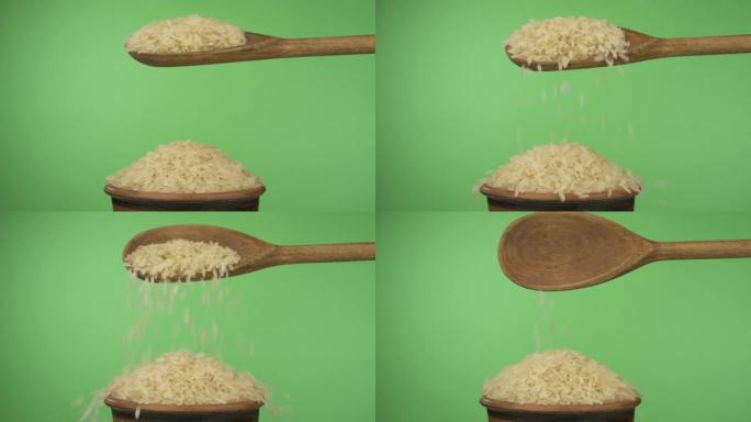 慢动作。米粒从木勺上的粘土碗中的一堆种子上获得足够的睡眠。