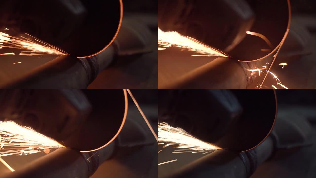 工匠在车间用圆盘磨床锯金属。慢动作。来自铁水的火花。