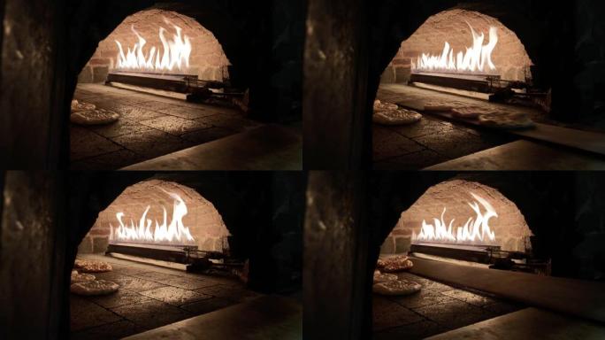 烤箱内的面包，从砖烤箱中取出面包，皮塔面包，烤箱内的土耳其披萨皮塔饼