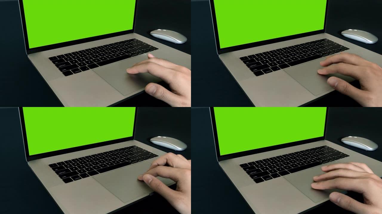 带男士工作触摸板的电脑笔记本电脑绿屏