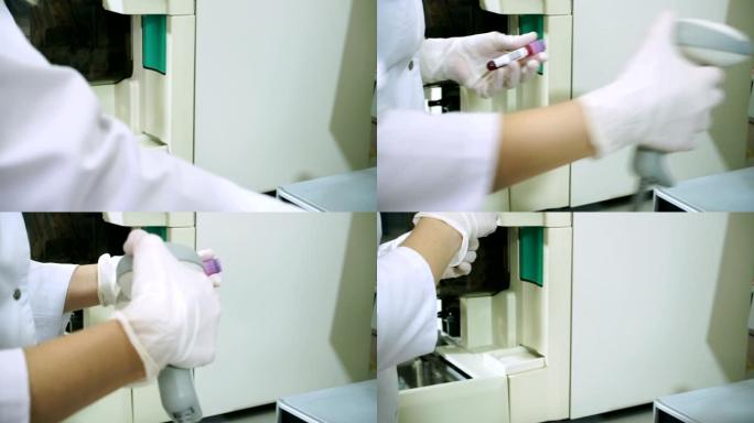 女科学家在实验室的现代设备上分析血液样本。高清