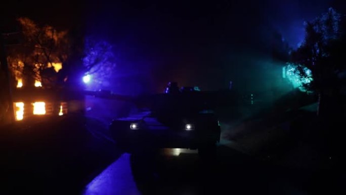 战争的概念。装甲车辆剪影战斗场景的战争，雾蒙蒙的天空背景在晚上。美国坦克准备战斗。创意装饰