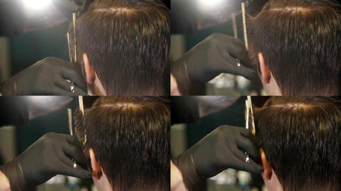 理发师用剪刀剪着客户的头发