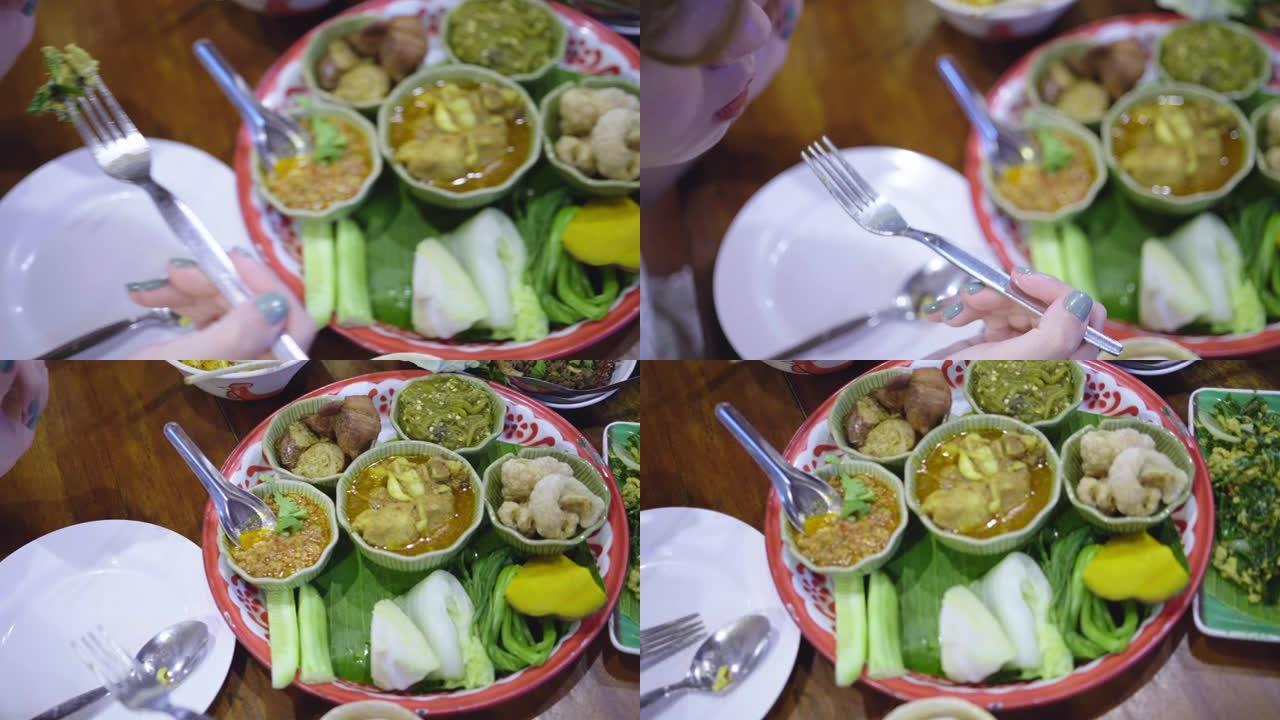 享受美味和传统食物的亚洲女性