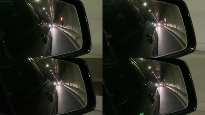 汽车在隧道中行驶，从侧视镜镜观察