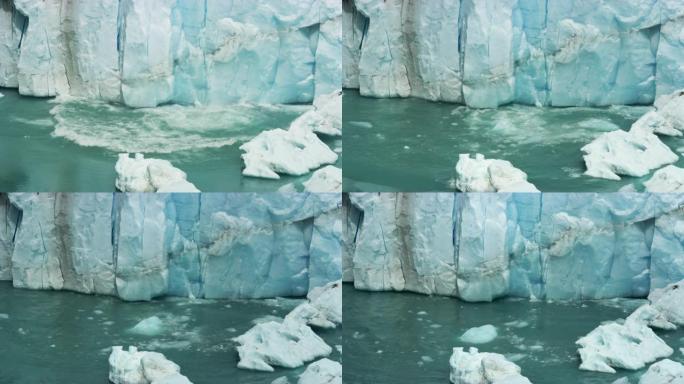 沿佩里托·莫雷诺冰川的冰块破裂落入水中