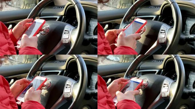 一名妇女在开车时使用智能手机。