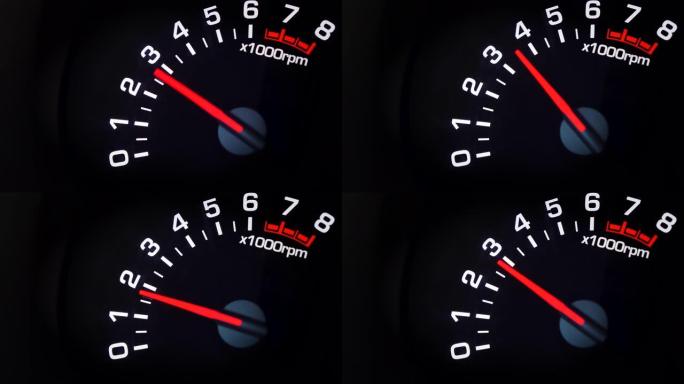 汽车转速表和其上的移动指针指示变化的发动机RPM。汽车仪表板。带有指示灯的仪表板详细信息。汽车仪表板