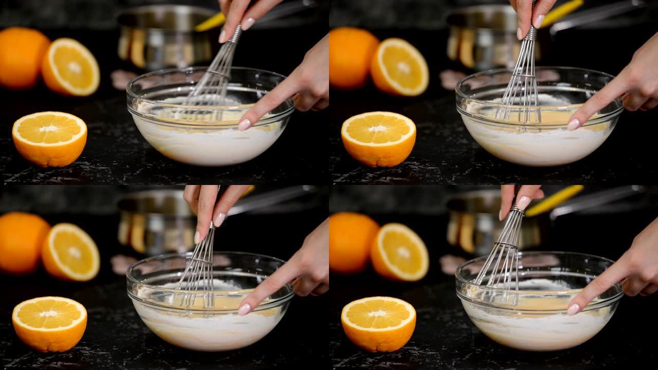 厨师搅拌橙色奶油。