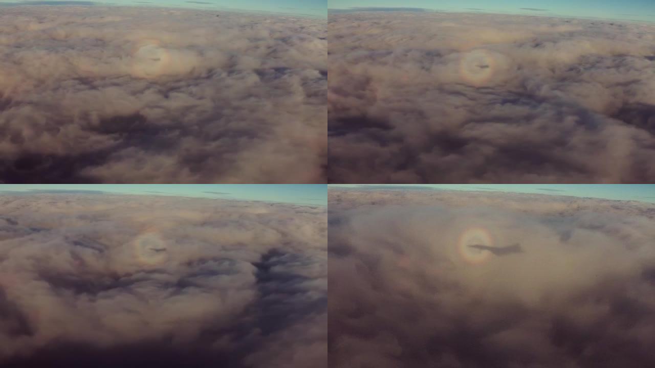 云层上的飞机阴影云海高空机翼机舱窗外