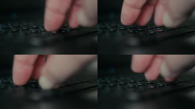 男性手在黑色笔记本电脑键盘上拨打文字。