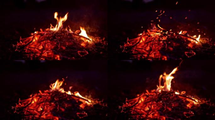 木头的余烬在黑暗中燃烧和闷烧。