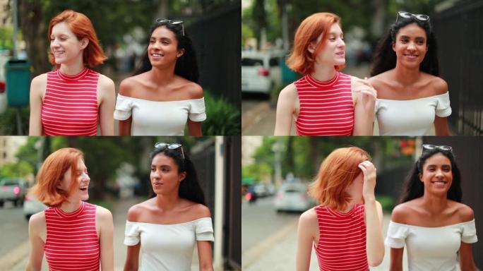 两个女性朋友一起在城市里散步聊天。慢动作中的多种族年轻女性
