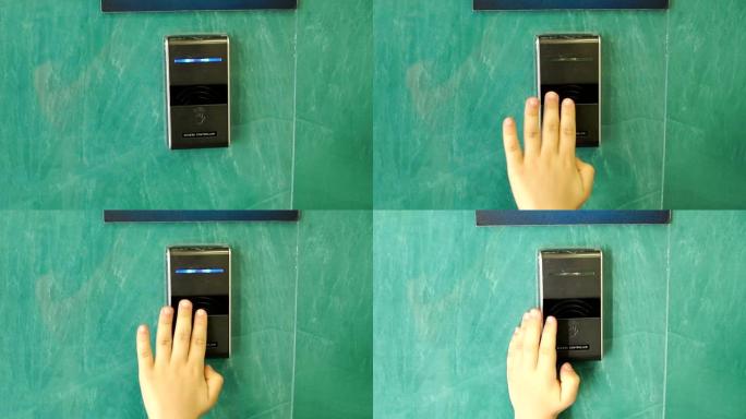 儿童用触摸键打开自动门的手的特写镜头。