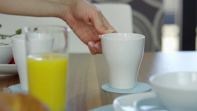 Close Up Of Someone Pouring Hot Coffee Into Mug