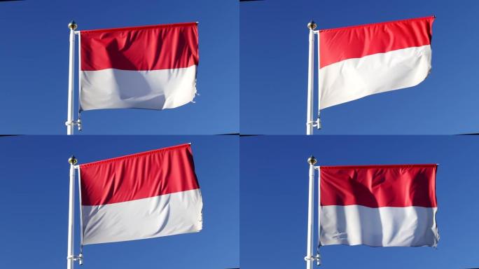 近距离观看印度尼西亚国旗在风中飘扬，蓝天背景上没有云彩
