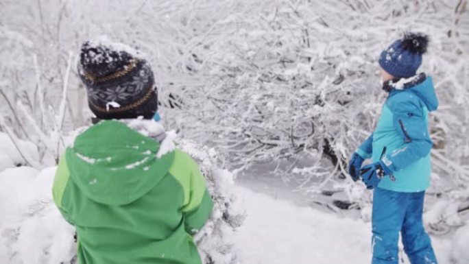 Kids having snowball fight in fresh snow