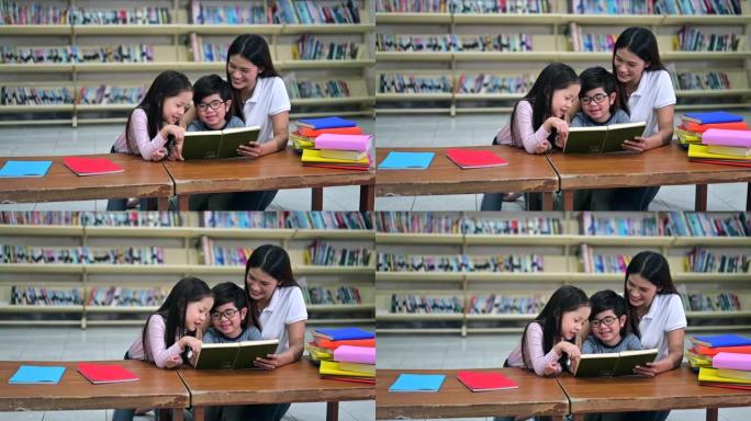 一群亚洲孩子与老师一起在学校图书馆读书，背景书架