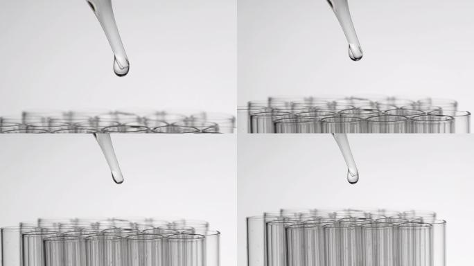 科学家将液体滴入试管的特写镜头