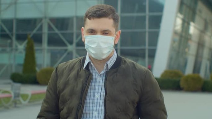 在机场附近戴着防护口罩的男子看。健康与安全生命的概念，N1H1冠状病毒，病毒保护。大流行新型冠状病毒