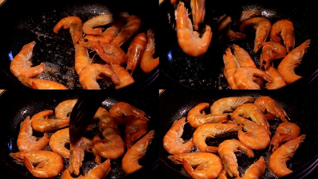 大虾在铁锅里煎炸。