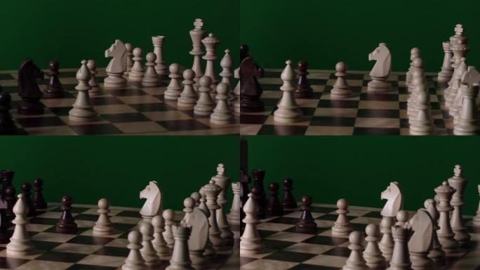 绿色背景下的象棋。带棋子的棋盘。
