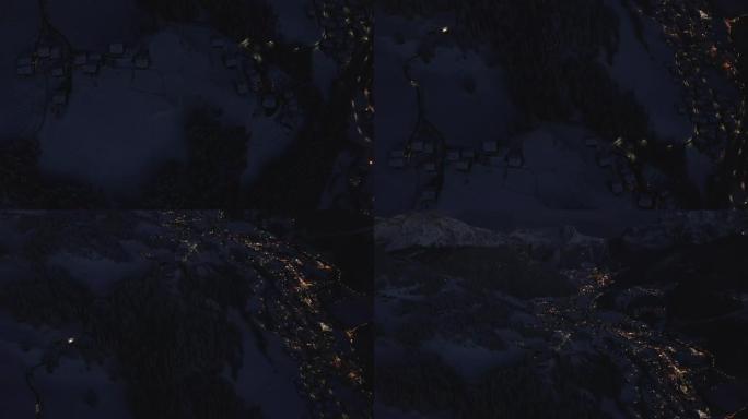 多洛米蒂瓦尔加迪纳滑雪胜地山村的空中夜景。