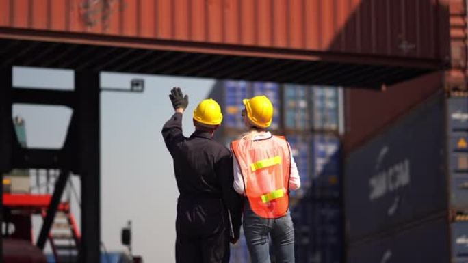 工程师和工头在仓库运输中的指挥通信从货物运输