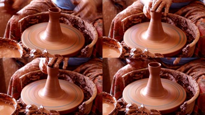 陶工之手制作了一个粘土壶