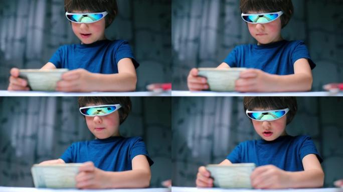 儿童戴着特殊眼镜在手机上玩电子游戏的肖像。