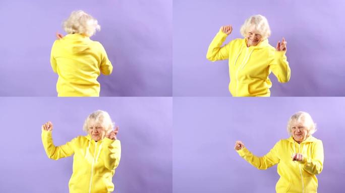 穿着黄色运动运动衫的时尚奶奶走向音乐、舞会、时尚