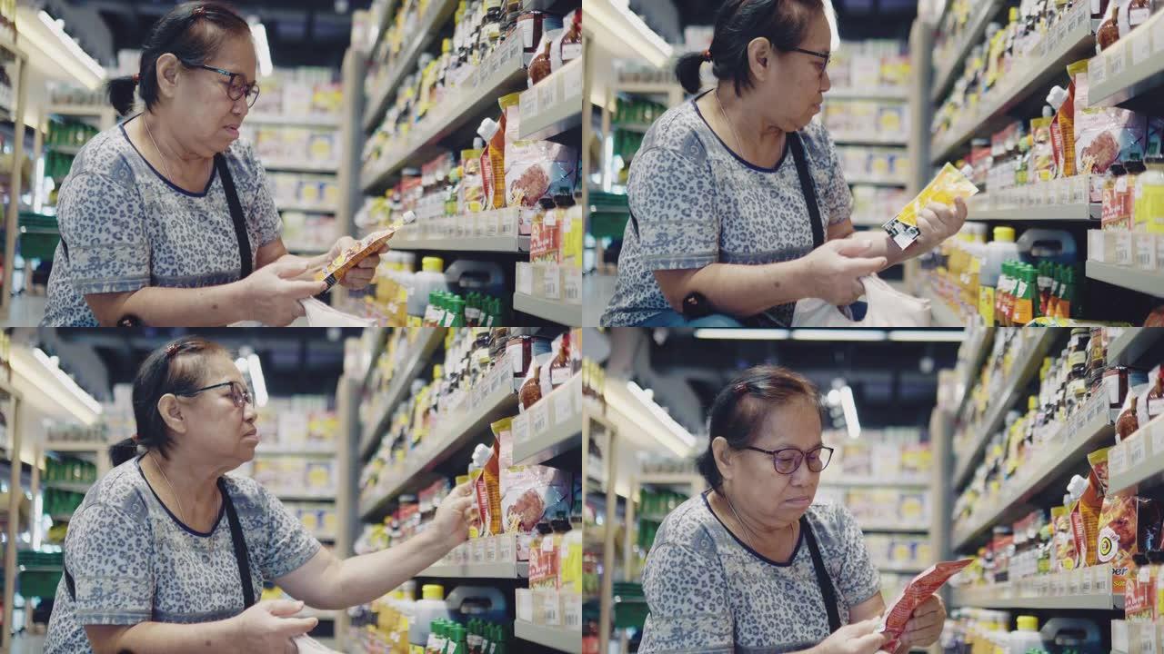 女人在调味品标签上阅读