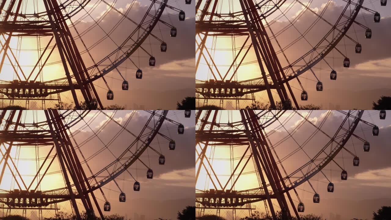 摩天轮在风景如画的日落中旋转
