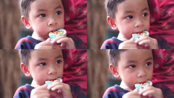 亚洲男婴吃糖果
