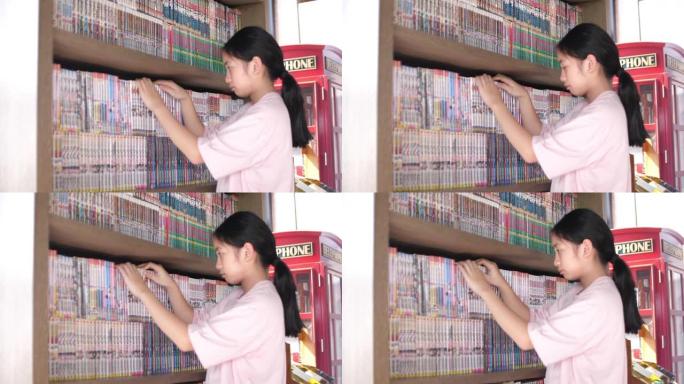 一个亚洲女孩在图书馆找到一本书，4K